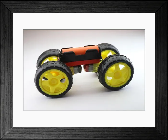 Framed Print : Mini Electric car working model made from hobby wheels, dc motor and rechargeable battery as a science activity Framed Print : Mini Electric car working model made from hobby wheels, dc motor and rechargeable battery as a science activity