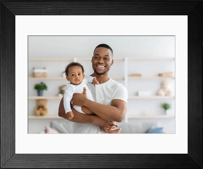 Framed Print : Fatherhood. Portrait Of Happy Young Black Man Holding His Adorable Infant Baby Framed Print : Fatherhood. Portrait Of Happy Young Black Man Holding His Adorable Infant Baby