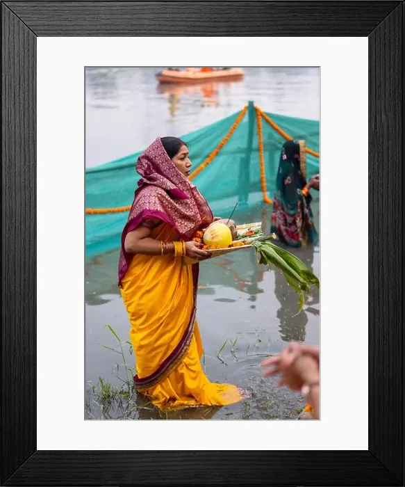 Framed Print : Chhath Puja, Indian hindu female devotee performing rituals of chhath puja while standing in river to worship lord sun Framed Print : Chhath Puja, Indian hindu female devotee performing rituals of chhath puja while standing in river to worship lord sun