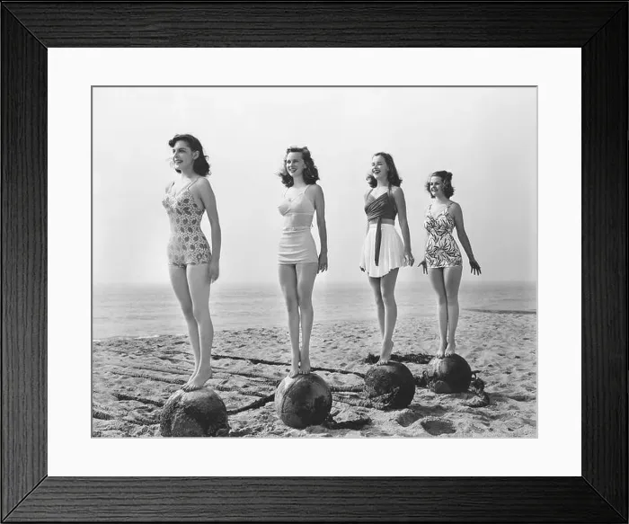Framed Print : Vintage black and white photography of 4 women in swimsuit standing tall on rocks at a beach Framed Print : Vintage black and white photography of 4 women in swimsuit standing tall on rocks at a beach