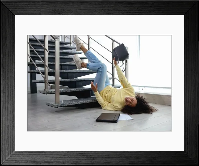 Framed Print : Woman falling on stairs in building. Dangerous accident Framed Print : Woman falling on stairs in building. Dangerous accident