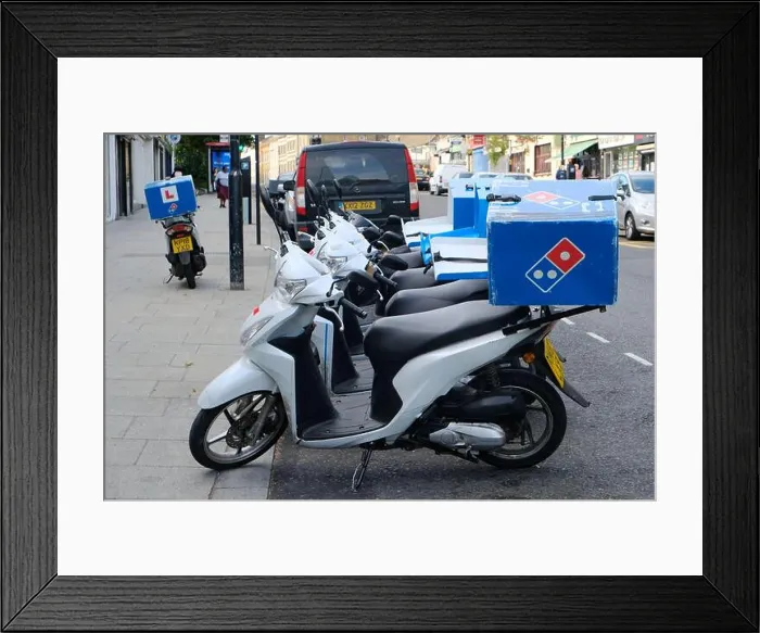 Framed Print : Parked mopeds used for home delivery of Dominos Pizzas on a roadside Framed Print : Parked mopeds used for home delivery of Dominos Pizzas on a roadside
