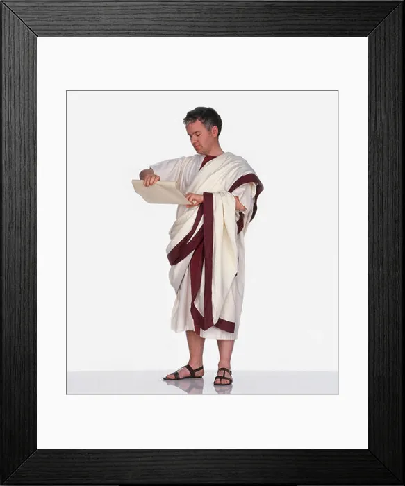 Framed Print : Man dressed as Roman citizen wearing toga and holding scroll of paper Framed Print : Man dressed as Roman citizen wearing toga and holding scroll of paper