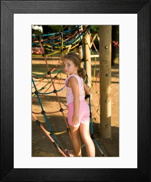 Framed Print : Little girl at the playground looking backwards Framed Print : Little girl at the playground looking backwards