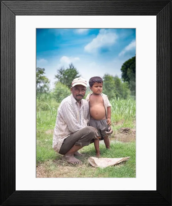 Framed Print : Real people from rural India: Happy father and son. Indian farmer with his son in field. copy space to write text Framed Print : Real people from rural India: Happy father and son. Indian farmer with his son in field. copy space to write text