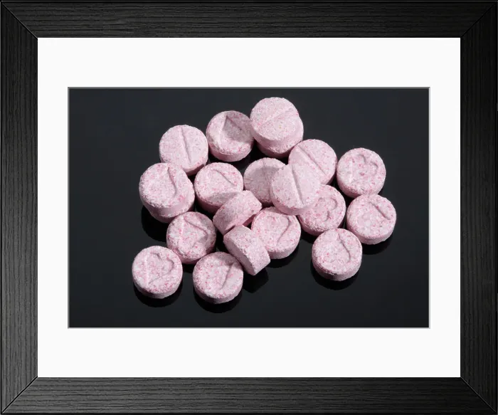 Framed Print : Pink coloured Ecstasy tablet illegal drugs Pills Framed Print : Pink coloured Ecstasy tablet illegal drugs Pills