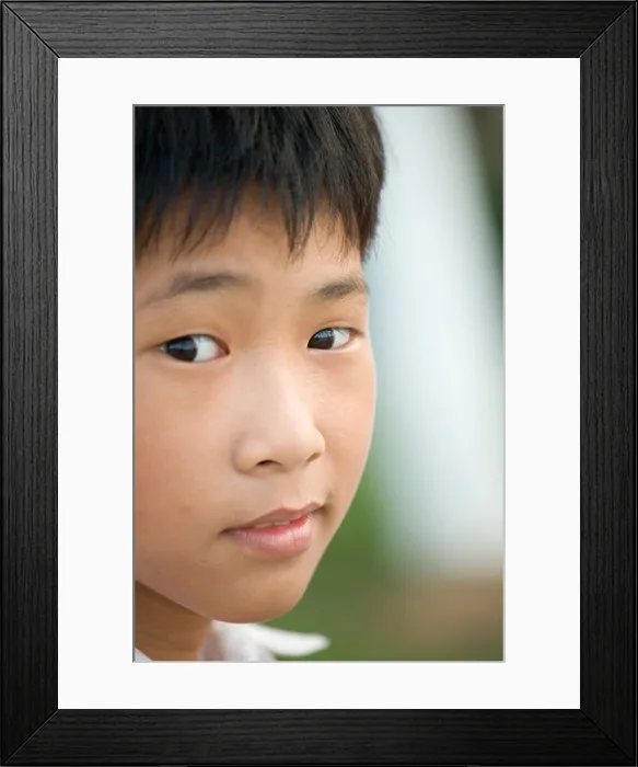 Framed Print : Vietnamese boy with sly sideways glance, Danang, Vietnam Framed Print : Vietnamese boy with sly sideways glance, Danang, Vietnam