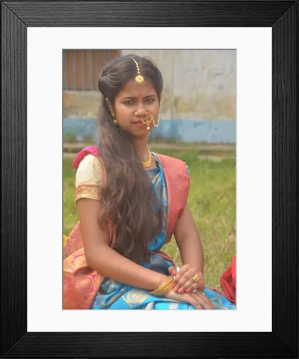 Framed Print : Close up of a teenage Indian girls wearing sari Framed Print : Close up of a teenage Indian girls wearing sari