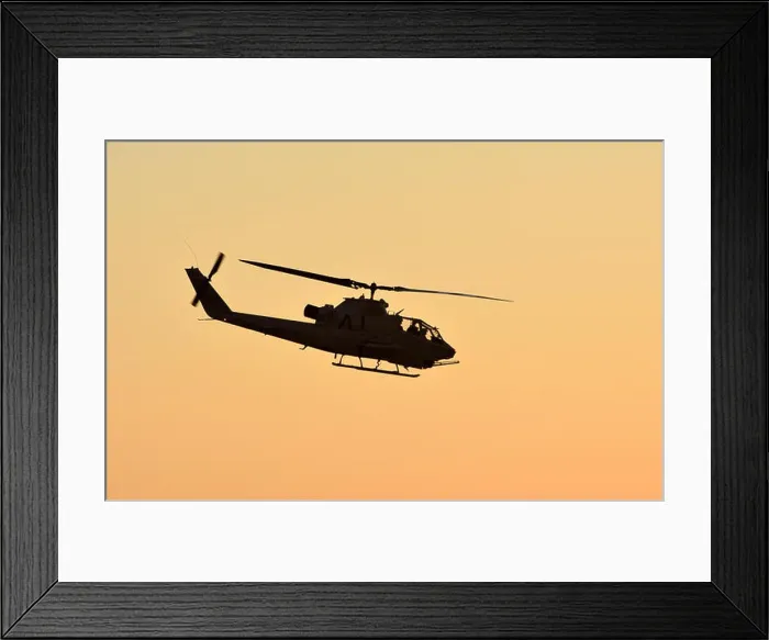 Framed Print : Vietnam War era army helicopter flying at sunset side view Framed Print : Vietnam War era army helicopter flying at sunset side view