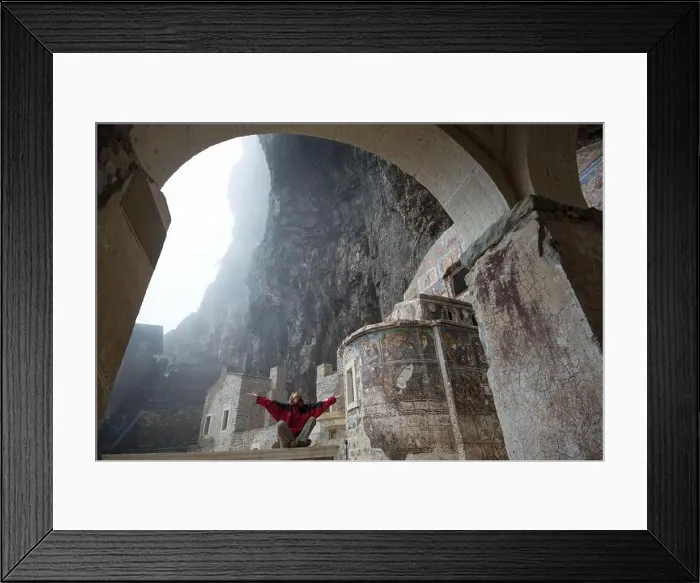 Framed Print : Woman dressed in red clothes meditates in Sumela Monastery (Turkey) Framed Print : Woman dressed in red clothes meditates in Sumela Monastery (Turkey)