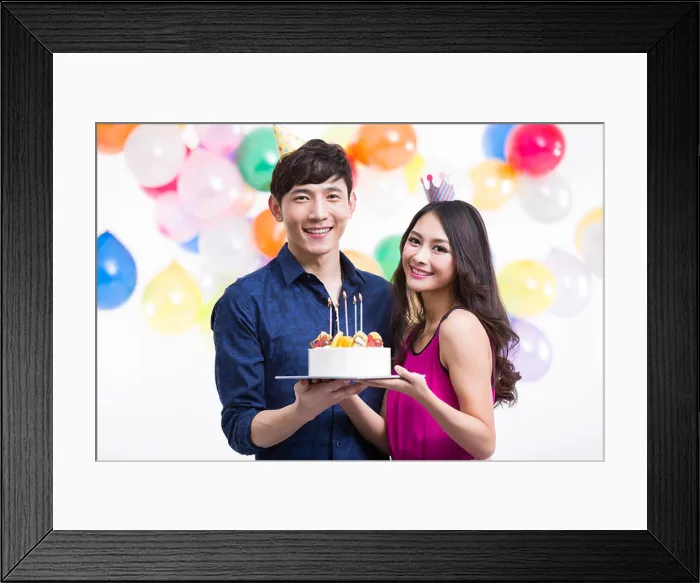 Framed Print : Young couple celebrating birthday Framed Print : Young couple celebrating birthday