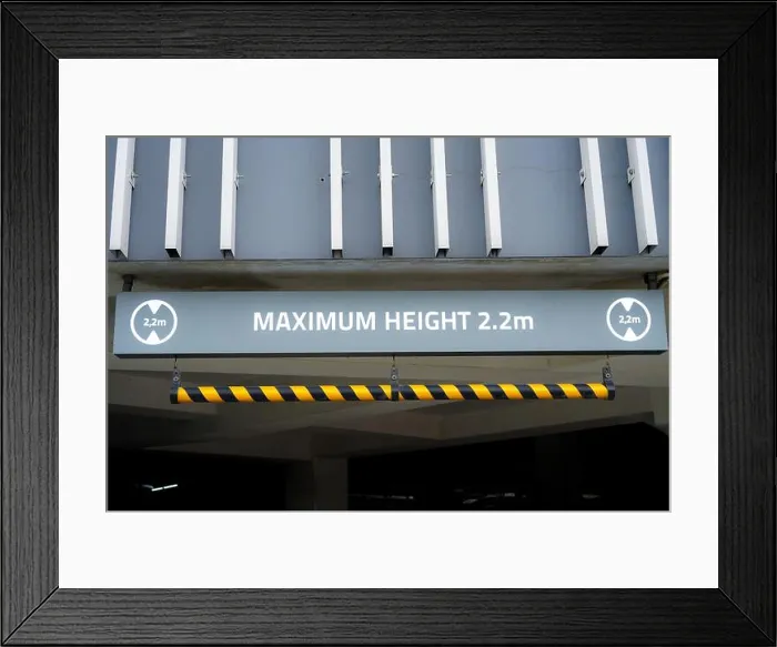 Framed Print : Sign: Maximum Height 2.2m, red and white, hanging from carpark ceiling Framed Print : Sign: Maximum Height 2.2m, red and white, hanging from carpark ceiling