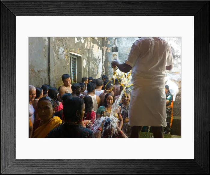 Framed Print : Hindu pilgrims receiving the holy bath at the Ramanathaswamy Temple in Rameswaram, Tamil Nadu, India Framed Print : Hindu pilgrims receiving the holy bath at the Ramanathaswamy Temple in Rameswaram, Tamil Nadu, India