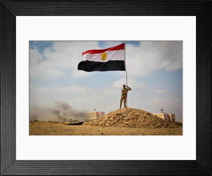 Framed Print : An Egyptian service member places an Egyptian national flag during an Egyptian military demonstration for observers Framed Print : An Egyptian service member places an Egyptian national flag during an Egyptian military demonstration for observers