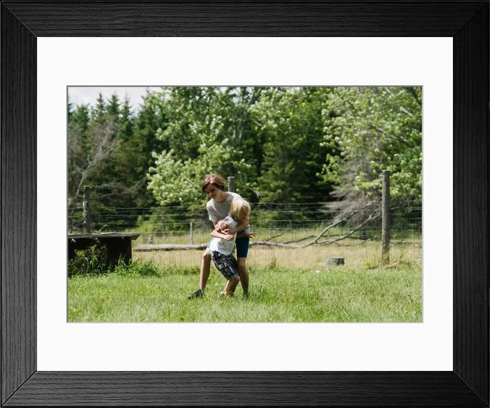 Framed Print : Canada, Ontario, Kingston, Boys (8-9, 14-15) play fighting outdoors Framed Print : Canada, Ontario, Kingston, Boys (8-9, 14-15) play fighting outdoors