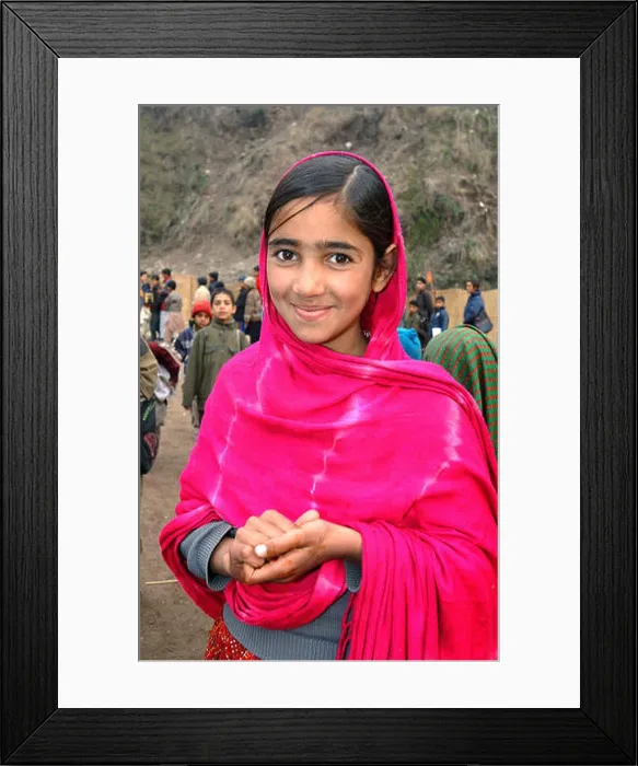 Framed Print : A girl smiles at an open-air school near the city of Muzaffarabad Framed Print : A girl smiles at an open-air school near the city of Muzaffarabad