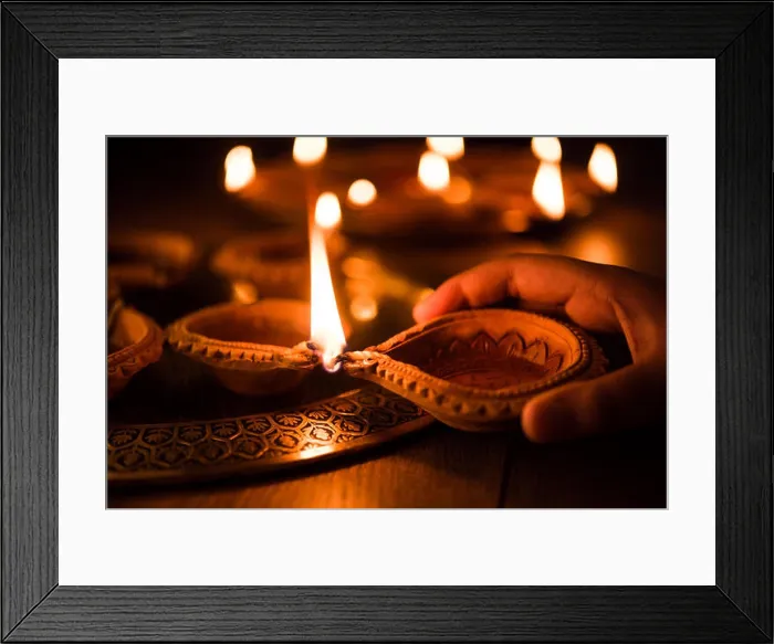 Framed Print : Happy diwali - Hand holding or lighting or arranging diwali diya or clay lamp in brass plate, selective focus Framed Print : Happy diwali - Hand holding or lighting or arranging diwali diya or clay lamp in brass plate, selective focus