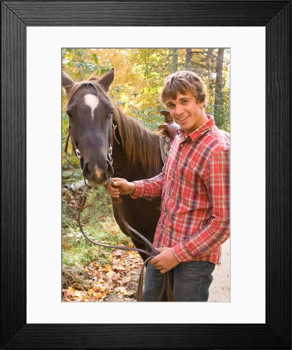 Framed Print : Man holding horse by the reins Framed Print : Man holding horse by the reins