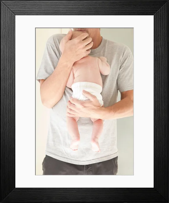 Framed Print : New dad holding baby in a diaper Framed Print : New dad holding baby in a diaper