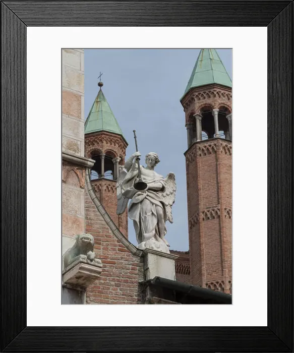 Framed Print : Angel holding a trumpet on the facade of Cremona Cathedral, Lombardy region, Italy Framed Print : Angel holding a trumpet on the facade of Cremona Cathedral, Lombardy region, Italy