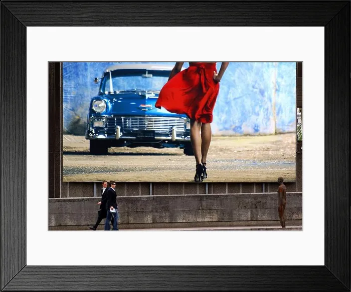 Framed Print : Pedestrians, under a huge billboard in the background Framed Print : Pedestrians, under a huge billboard in the background