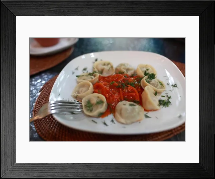 Framed Print : Russian pelmeni with vegetable salsa on a white plate Framed Print : Russian pelmeni with vegetable salsa on a white plate