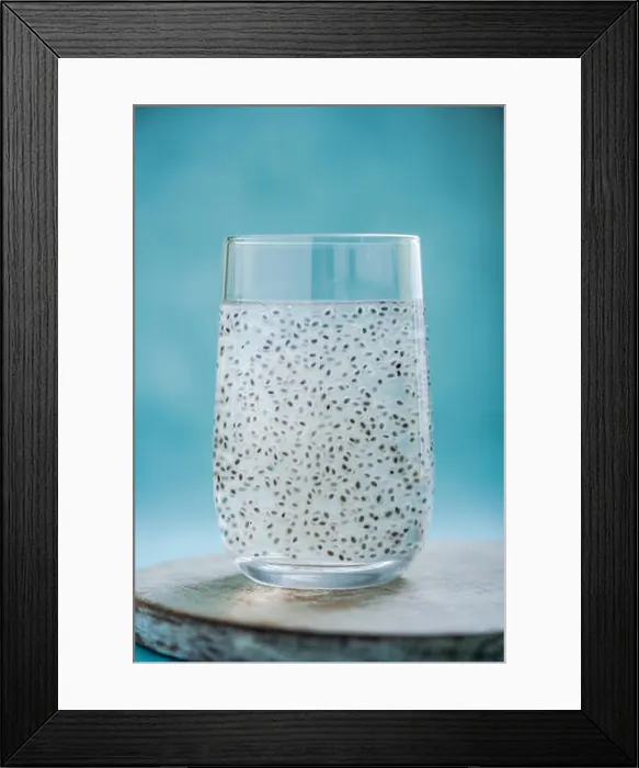 Framed Print : coconut water with basil seeds in glass on bright background Framed Print : coconut water with basil seeds in glass on bright background