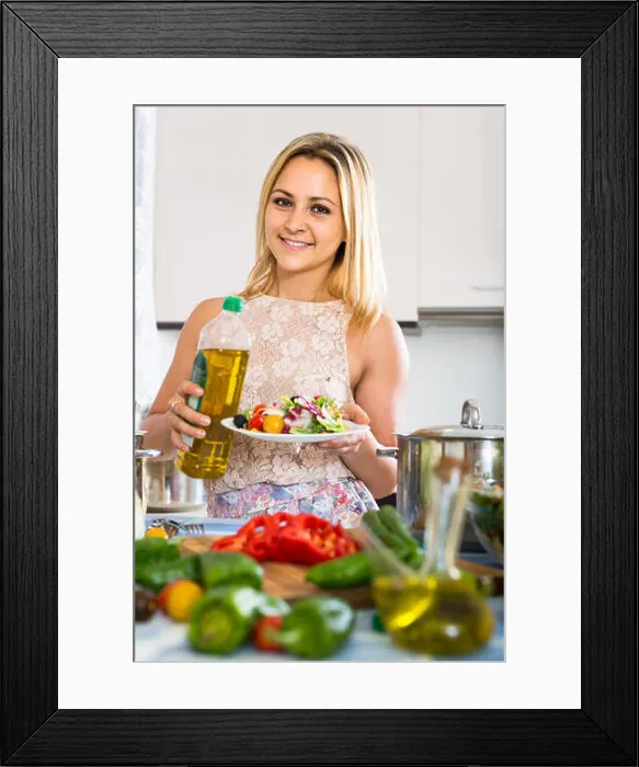 Framed Print : young russian girl standing at kitchen table with plate of salad Framed Print : young russian girl standing at kitchen table with plate of salad