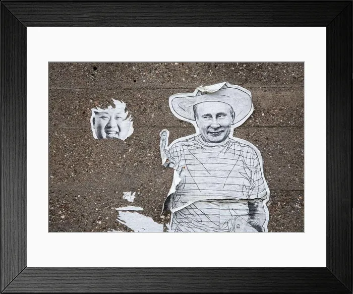 Framed Print : remains of a poster with Kim Jong-un and Vladimir Putin on a wall in the Deutz district Framed Print : remains of a poster with Kim Jong-un and Vladimir Putin on a wall in the Deutz district