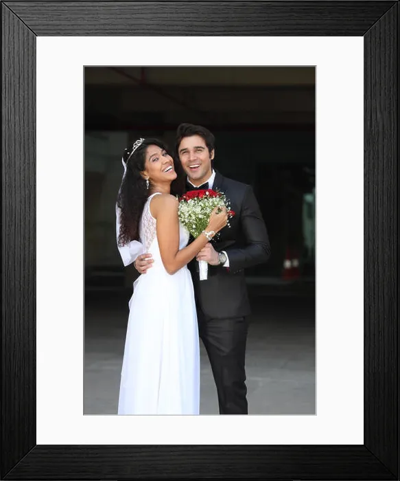 Framed Print : Newlywed couple standing together and smiling