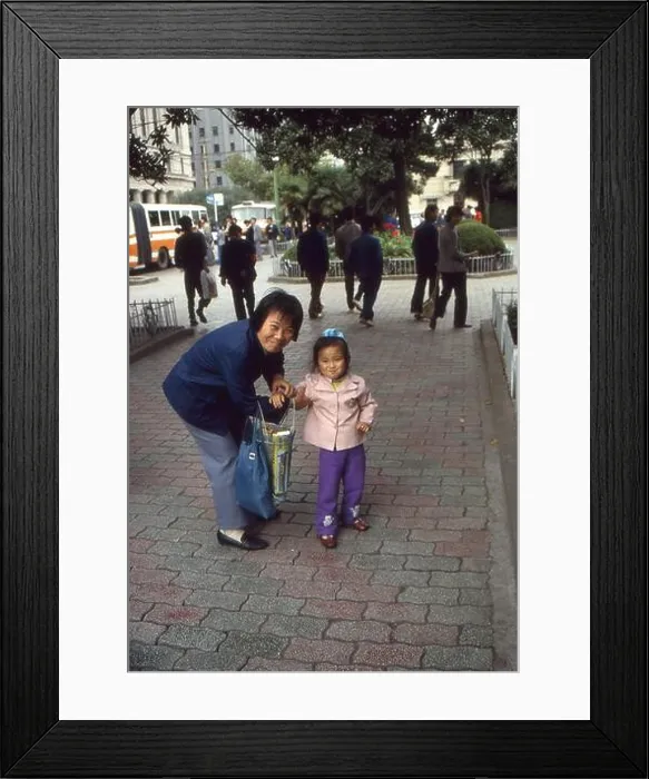Framed Print : A grandmother with her grandchild in Shanghai in China Framed Print : A grandmother with her grandchild in Shanghai in China
