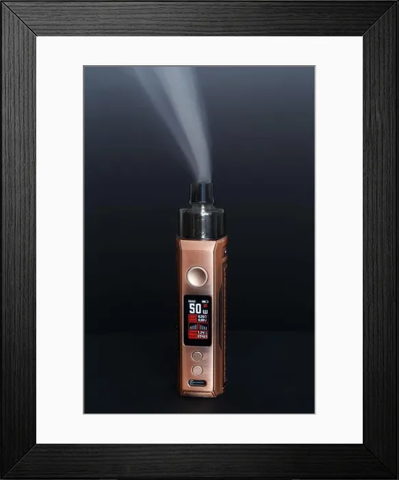 Framed Print : A modern electronic device with a display and buttons for vaping. Macro photo on a dark background Framed Print : A modern electronic device with a display and buttons for vaping. Macro photo on a dark background