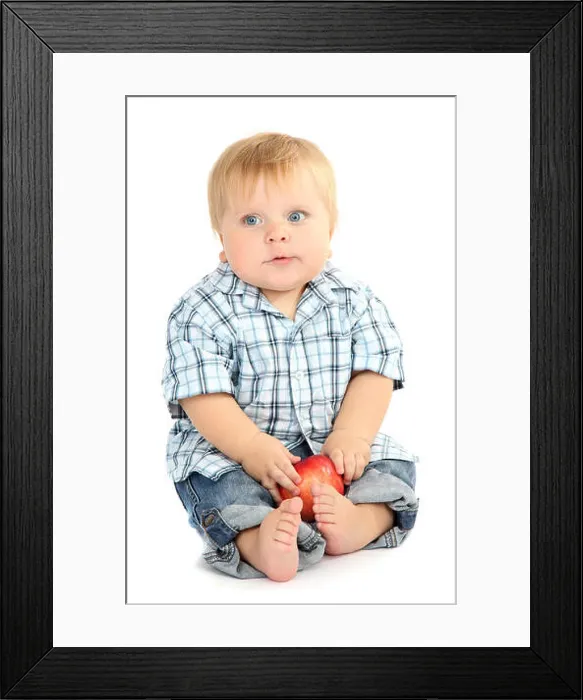 Framed Print : Little boy with red apple, isolated on white Framed Print : Little boy with red apple, isolated on white