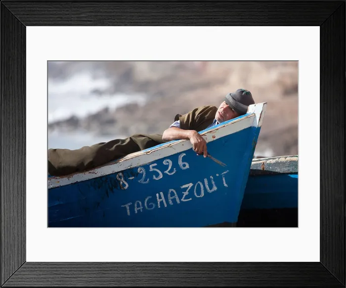 Framed Print : Fisher man sleeping in fishingboat, Taghazout, Morocco