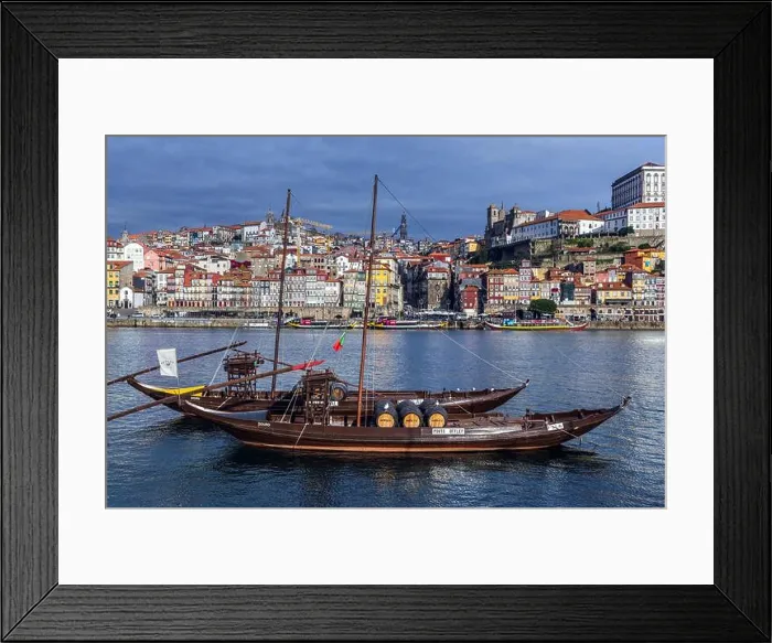 Framed Print : Sandeman and Porto Cruz Port wine boats called Rabelo Boats on a Douro River in Vila Nova de Gaia city Framed Print : Sandeman and Porto Cruz Port wine boats called Rabelo Boats on a Douro River in Vila Nova de Gaia city