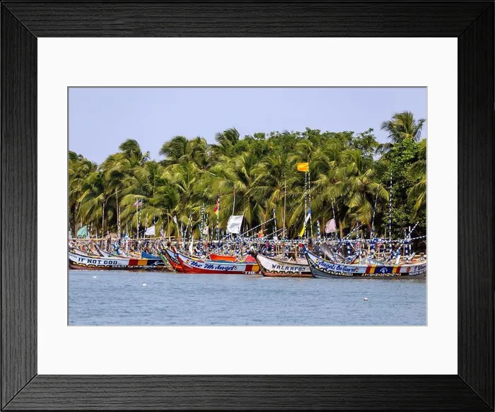 Framed Print : Fishing village of Ada Foah with brightly painted boats on the banks of the Volta River in the Greater Accra region of Framed Print : Fishing village of Ada Foah with brightly painted boats on the banks of the Volta River in the Greater Accra region of