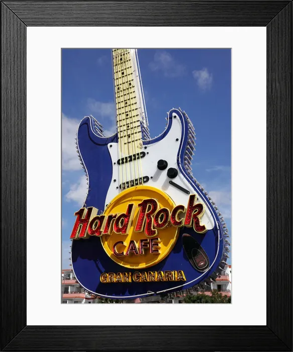 Framed Print : the famous hard rock cafe guitar sign outside playa del ingles gran canaria Framed Print : the famous hard rock cafe guitar sign outside playa del ingles gran canaria