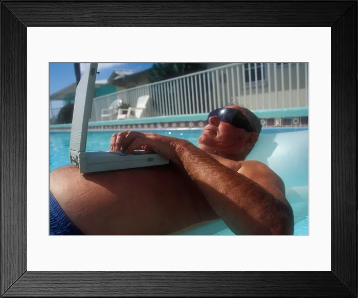 Framed Print : Floating in Pool laptop on Stomach Framed Print : Floating in Pool laptop on Stomach
