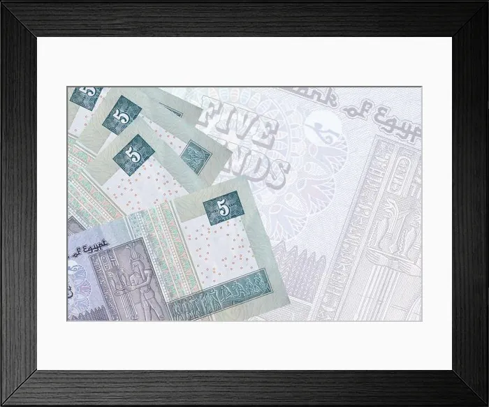 Framed Print : 5 Egyptian pounds bills lies in stack on background of big semi-transparent banknote Framed Print : 5 Egyptian pounds bills lies in stack on background of big semi-transparent banknote