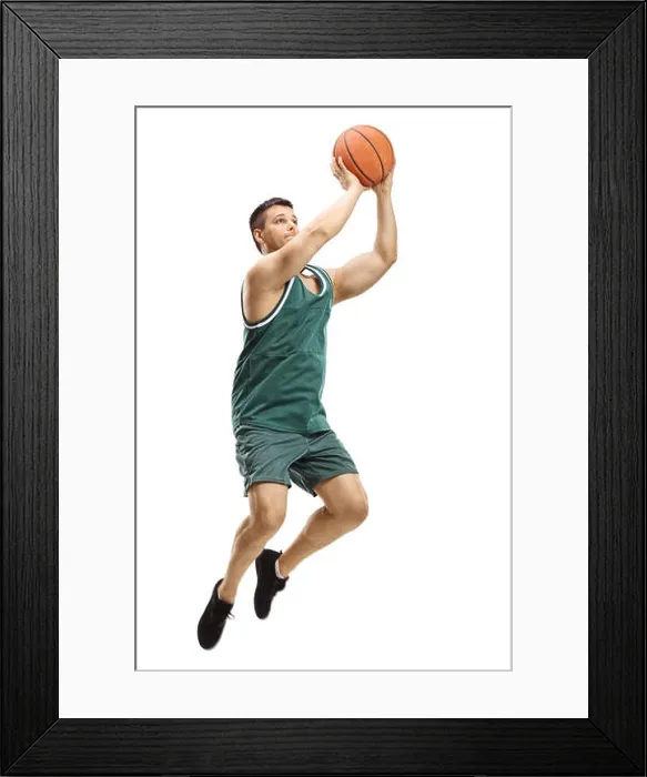 Framed Print : Full length shot of a male basketball player shooting a ball isolated on white background Framed Print : Full length shot of a male basketball player shooting a ball isolated on white background