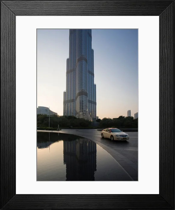 Framed Print : A taxi passes by the Burj Khalifa tower in Dubai, United Arab Emirates Framed Print : A taxi passes by the Burj Khalifa tower in Dubai, United Arab Emirates