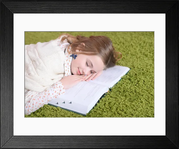 Framed Print : Portrait of cute tired schoolgirl sleeping at home Framed Print : Portrait of cute tired schoolgirl sleeping at home
