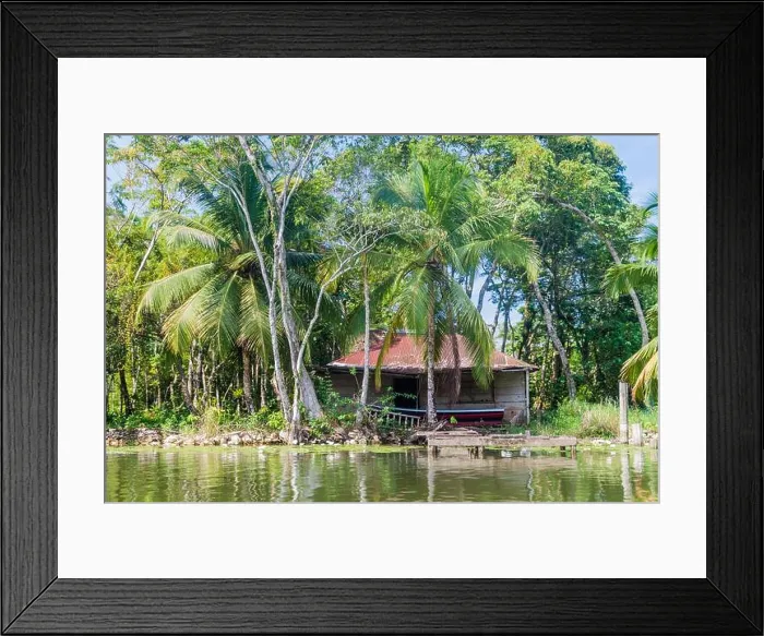 Framed Print : Small house at the coast of Rio Dulce river, Guatemala Framed Print : Small house at the coast of Rio Dulce river, Guatemala
