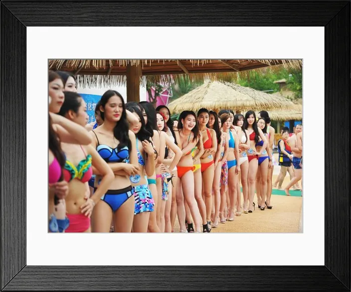 Framed Print : Bikini-dressed contestants pose in line during the first round for the Central China region of the Miss Bikini Global Framed Print : Bikini-dressed contestants pose in line during the first round for the Central China region of the Miss Bikini Global