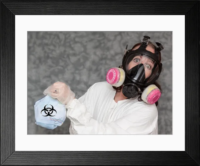 Framed Print : Concerned Woman with Gas Mask, gloves and Lab Coat holding Trash with Bio Hazard Symbol Framed Print : Concerned Woman with Gas Mask, gloves and Lab Coat holding Trash with Bio Hazard Symbol