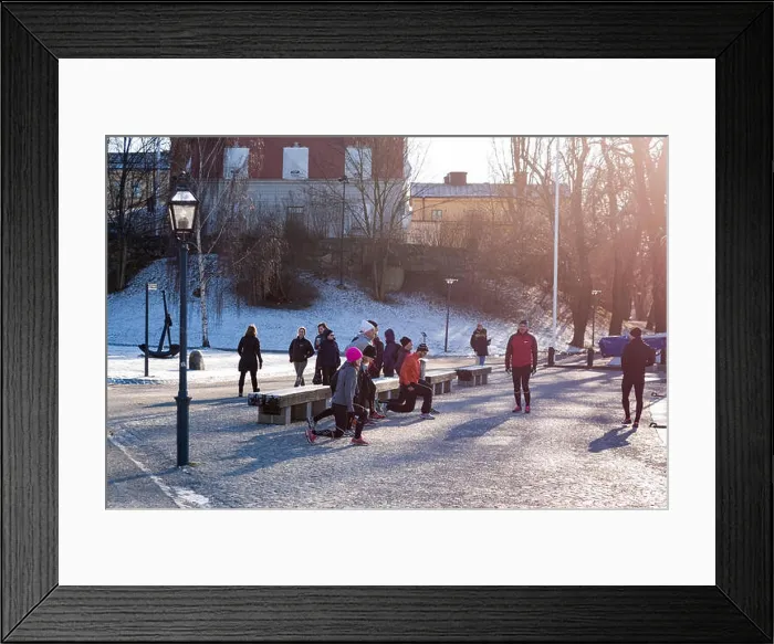 Framed Print : Group of people outdoors in cold winter warming up before going on a group run in Stockholm Framed Print : Group of people outdoors in cold winter warming up before going on a group run in Stockholm