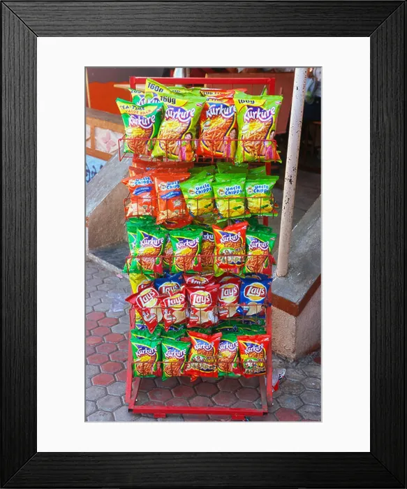 Framed Print : Snacks rack with packets of junk food Kurkure and Lays wafers India Framed Print : Snacks rack with packets of junk food Kurkure and Lays wafers India