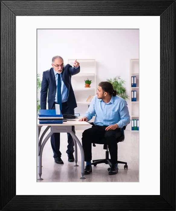 Framed Print : Old boss and his young assistant in the office Framed Print : Old boss and his young assistant in the office