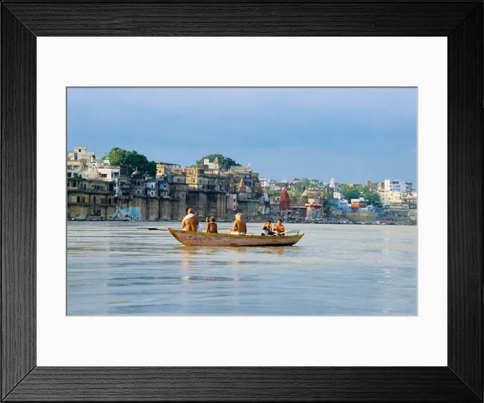 Framed Print : Hindu pilgrims at dawn in a boat on the river Ganges in Varanasi, India Framed Print : Hindu pilgrims at dawn in a boat on the river Ganges in Varanasi, India