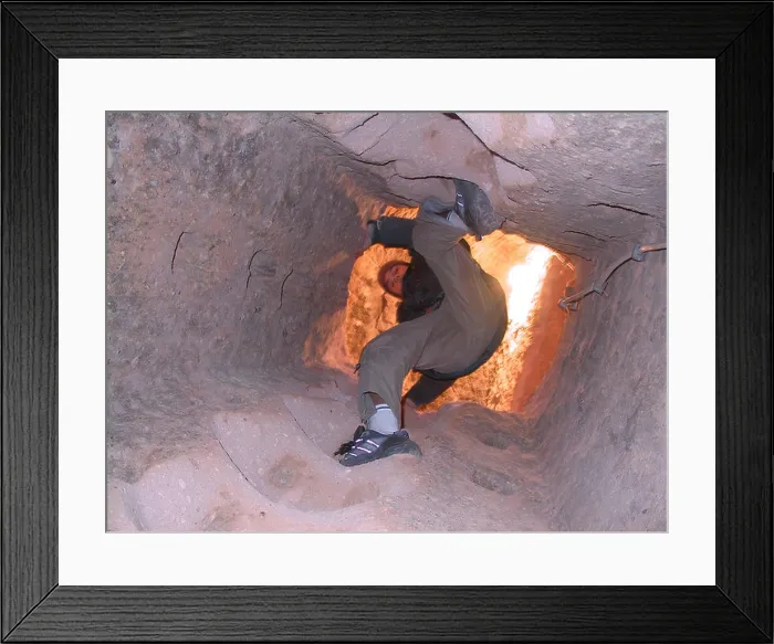 Framed Print : Boy climbing up a vertical tunnel in the underground city in Maz köy Cappadocia central Anatolia Turkey Framed Print : Boy climbing up a vertical tunnel in the underground city in Maz köy Cappadocia central Anatolia Turkey